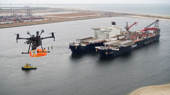 A drone flying towards the Pioneering Spirit